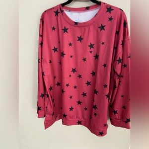 Cute red top!  Never been worn!  Red long sleeved star print shirt.
